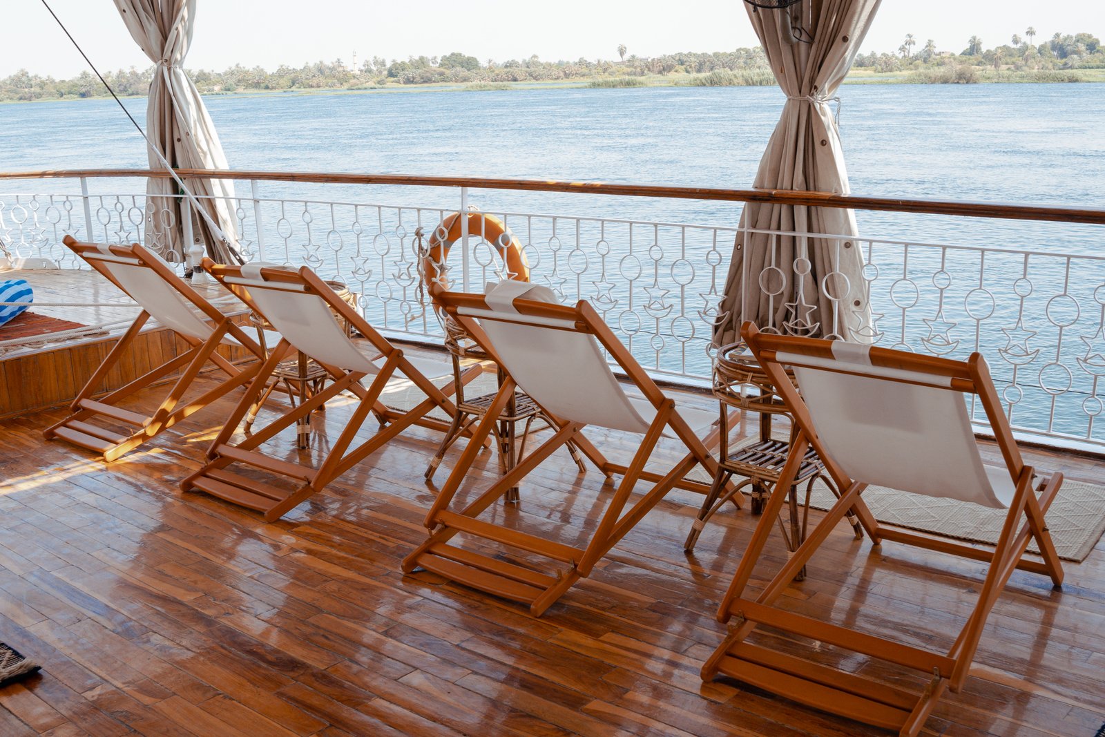 Fleur dahabiya sailing on the Nile at sunset