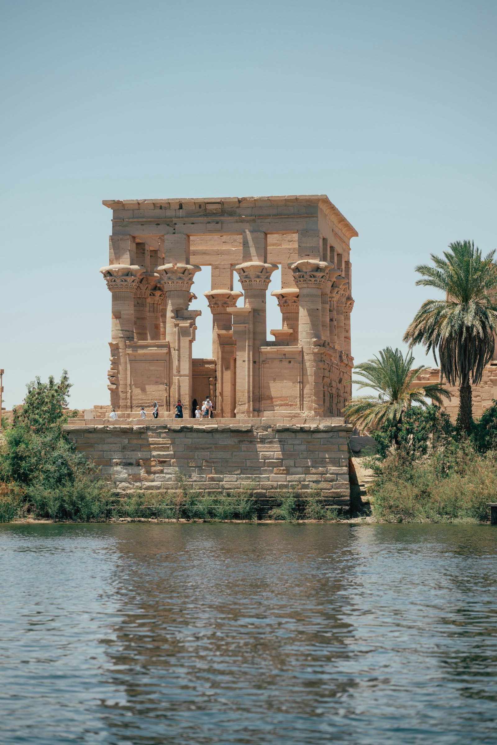 Aswan. The desert closes in and the river narrows between granite isla